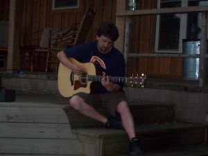 Jeff playing his guitar at the Cove